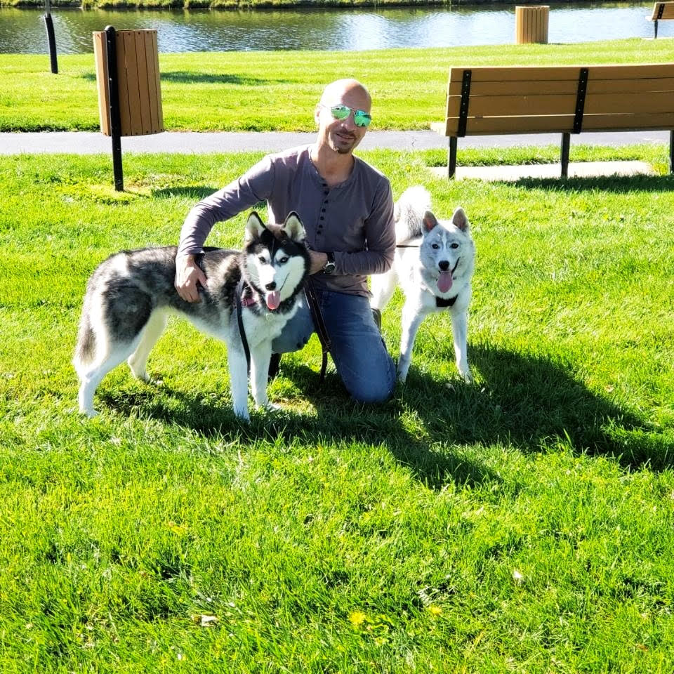 alan with his 2 siberian huskies
